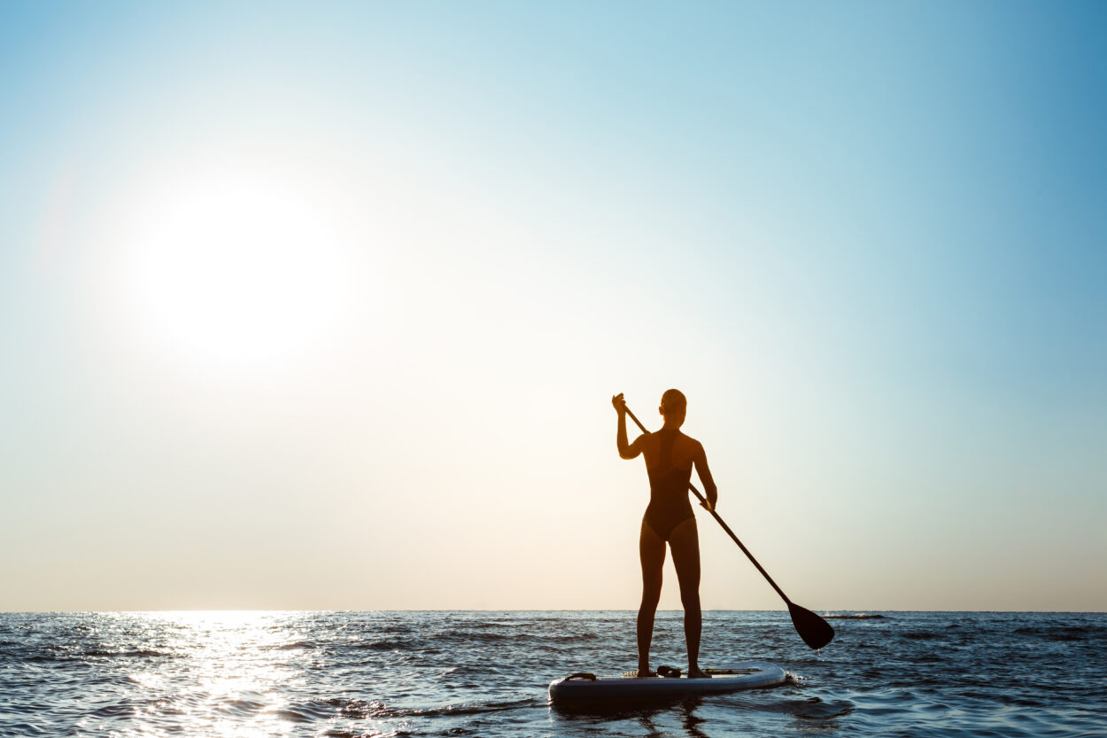 silhouette young beautiful woman surfing sea sunrise 1 scaled